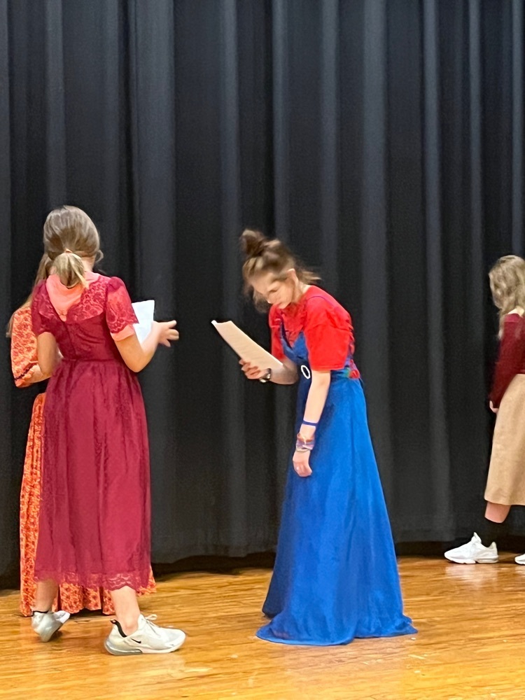 A group of ladies gossiping about marriage.