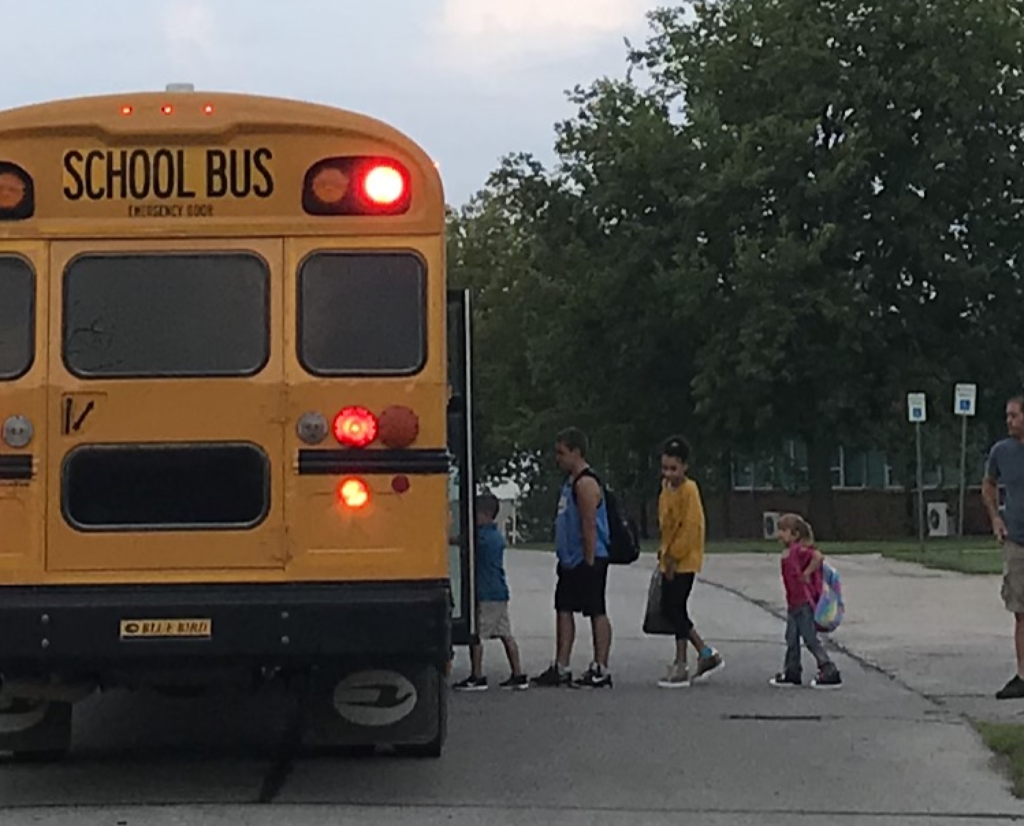 Students loading school bus